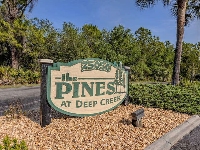 25050 Sandhill Blvd Unit 6A3, Punta Gorda, FL 33983 - community / neighborhood sign featuring view of scattered trees