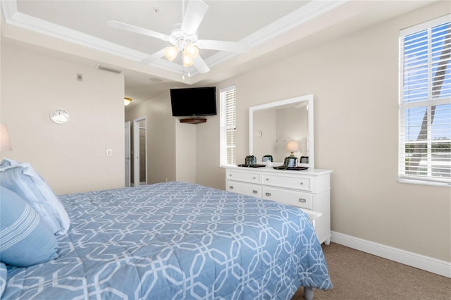235 Base Ave E Unit 207, Venice, FL 34285 - carpeted bedroom with a raised ceiling, crown molding, and ceiling fan