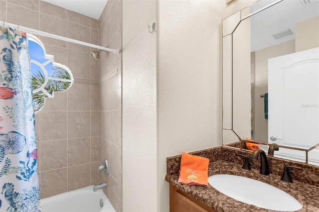 235 Base Ave E Unit 207, Venice, FL 34285 - full bathroom featuring shower / tub combo with curtain and vanity