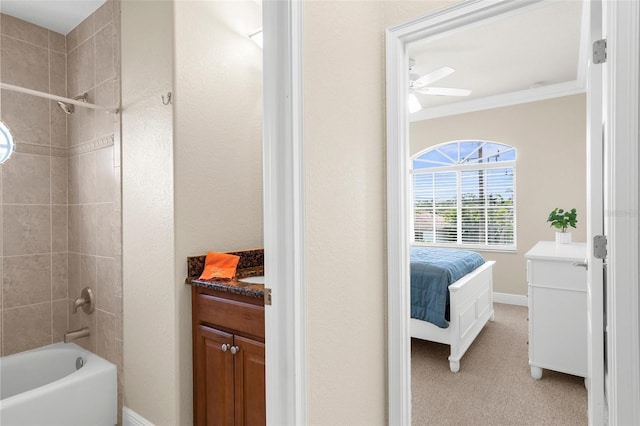235 Base Ave E Unit 207, Venice, FL 34285 - bathroom featuring vanity, tub / shower combination, a ceiling fan, crown molding, and ensuite bath