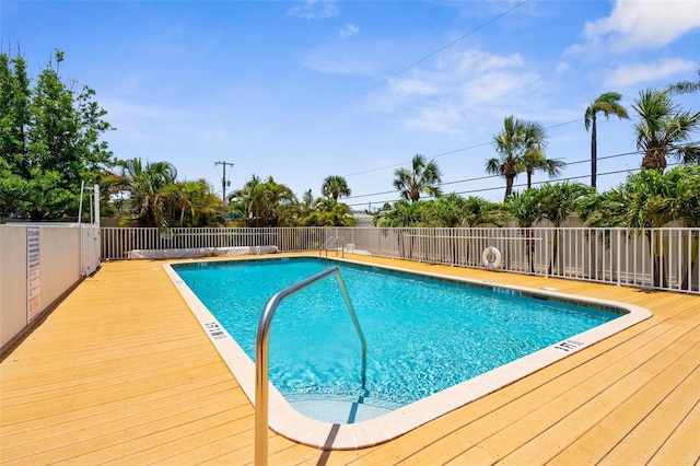 235 Base Ave E Unit 207, Venice, FL 34285 - community pool featuring a wooden deck