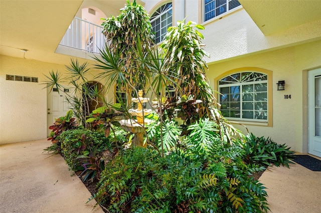 235 Base Ave E Unit 207, Venice, FL 34285 - property entrance featuring stucco siding