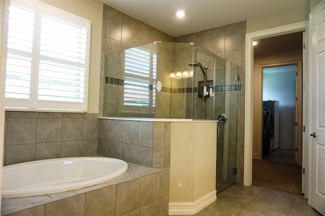 136 Positano Trl, Nokomis, FL 34275 - full bathroom with a shower stall, a bath, tile patterned flooring, washer / clothes dryer, and recessed lighting