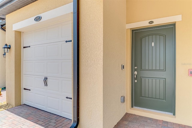 10213 Staggerbush Dr Unit 202, Venice, FL 34293 - view of exterior entry featuring stucco siding
