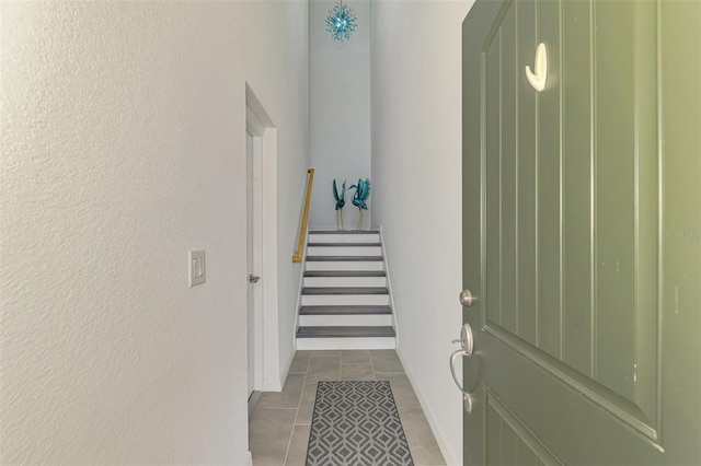 10213 Staggerbush Dr Unit 202, Venice, FL 34293 - stairway featuring tile patterned flooring and baseboards