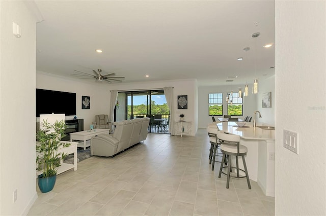 10213 Staggerbush Dr Unit 202, Venice, FL 34293 - living area with ceiling fan, recessed lighting, crown molding, and light tile patterned floors