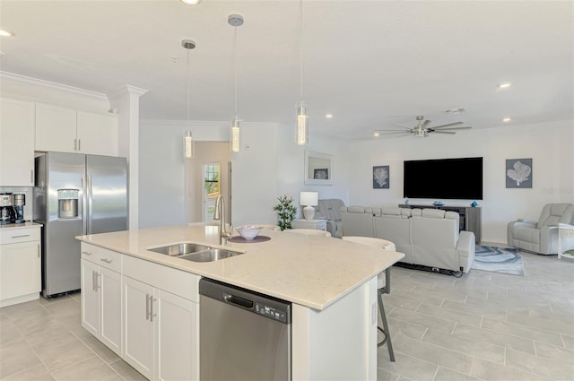 10213 Staggerbush Dr Unit 202, Venice, FL 34293 - kitchen featuring stainless steel appliances, a sink, ornamental molding, open floor plan, and light tile patterned floors