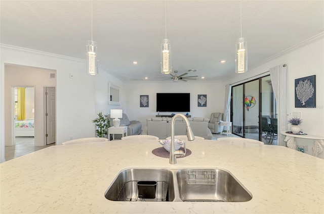 10213 Staggerbush Dr Unit 202, Venice, FL 34293 - kitchen with a sink, light stone counters, ceiling fan, ornamental molding, and open floor plan