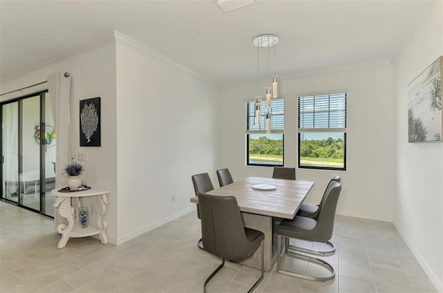 10213 Staggerbush Dr Unit 202, Venice, FL 34293 - dining space with crown molding, baseboards, light tile patterned floors, and a chandelier