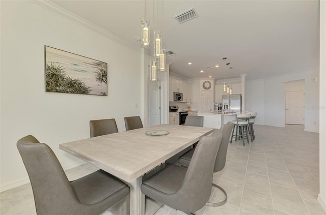 10213 Staggerbush Dr Unit 202, Venice, FL 34293 - dining space with crown molding, recessed lighting, light tile patterned floors, and baseboards