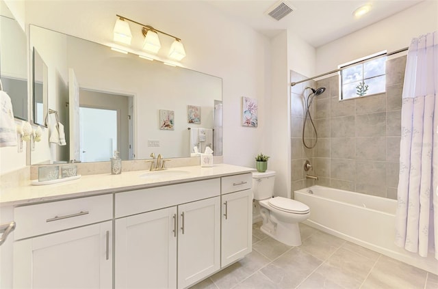 10213 Staggerbush Dr Unit 202, Venice, FL 34293 - bathroom featuring shower / tub combo with curtain, toilet, vanity, and tile patterned floors