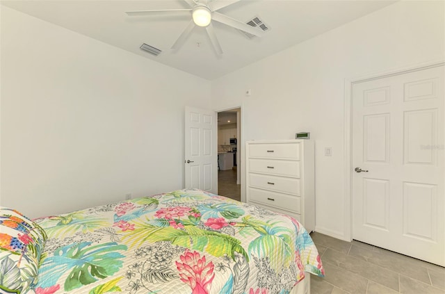 10213 Staggerbush Dr Unit 202, Venice, FL 34293 - bedroom featuring light tile patterned floors and a ceiling fan