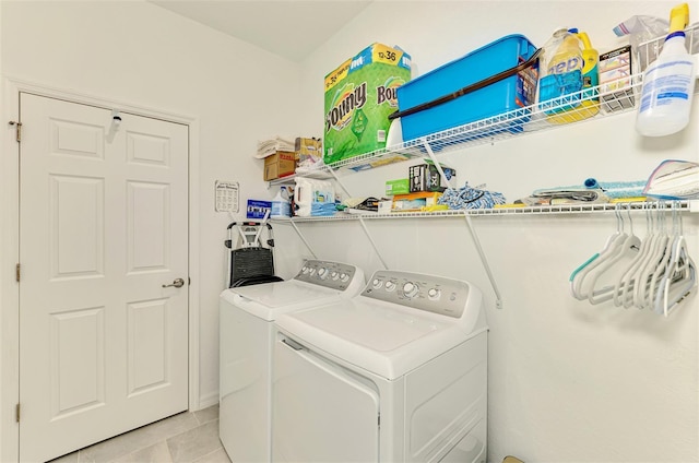 10213 Staggerbush Dr Unit 202, Venice, FL 34293 - laundry room with washing machine and clothes dryer and light tile patterned flooring