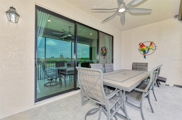 10213 Staggerbush Dr Unit 202, Venice, FL 34293 - view of patio featuring a ceiling fan and outdoor dining area