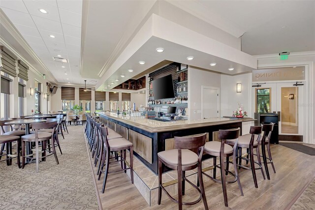 10213 Staggerbush Dr Unit 202, Venice, FL 34293 - community bar area with crown molding, light wood-style floors, recessed lighting, and french doors