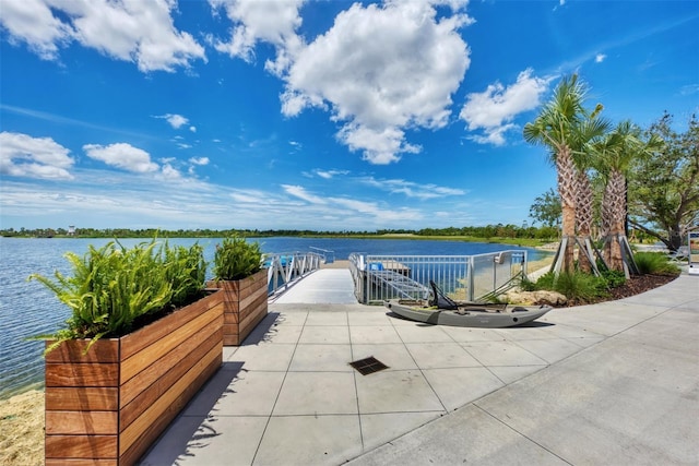 10213 Staggerbush Dr Unit 202, Venice, FL 34293 - view of patio / terrace with a water view