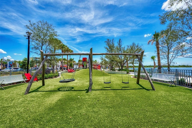 10213 Staggerbush Dr Unit 202, Venice, FL 34293 - community jungle gym featuring a water view