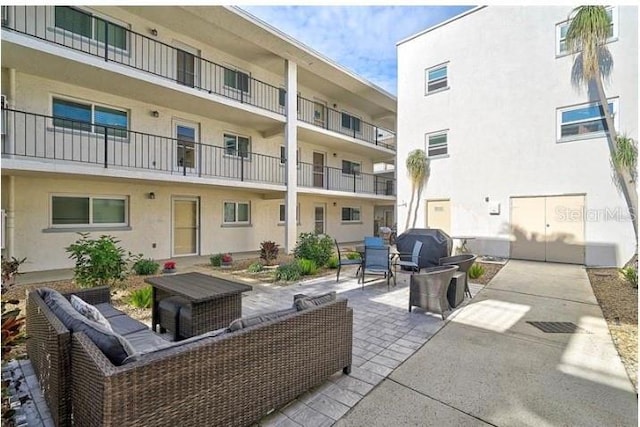 708 Tamiami Trl S Unit 115, Venice, FL 34285 - view of patio featuring outdoor lounge area and a grill