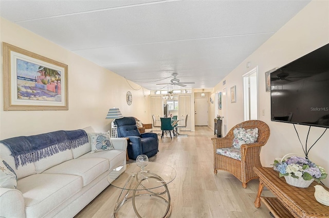 708 Tamiami Trl S Unit 115, Venice, FL 34285 - living room with ceiling fan and light wood-type flooring