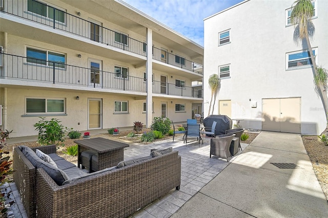 708 Tamiami Trl S Unit 115, Venice, FL 34285 - view of patio / terrace with outdoor lounge area and grilling area