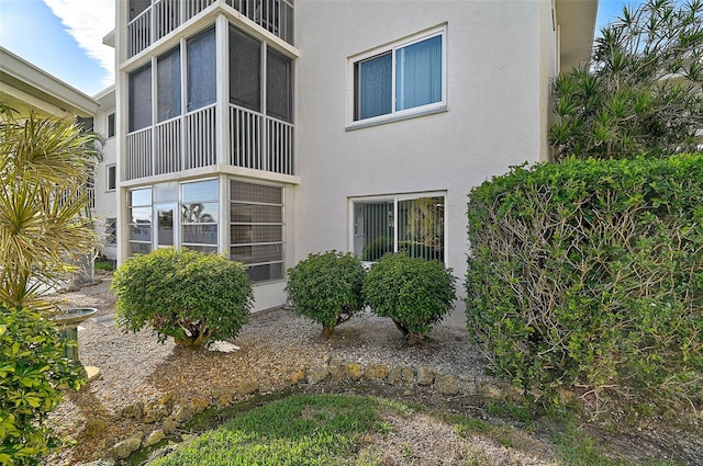 708 Tamiami Trl S Unit 115, Venice, FL 34285 - rear view of property featuring stucco siding and a balcony