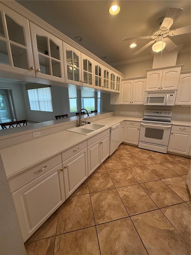 3790 Cadbury Cir Unit 40, Venice, FL 34293 - kitchen featuring white appliances, a sink, glass insert cabinets, white cabinets, and light tile patterned flooring