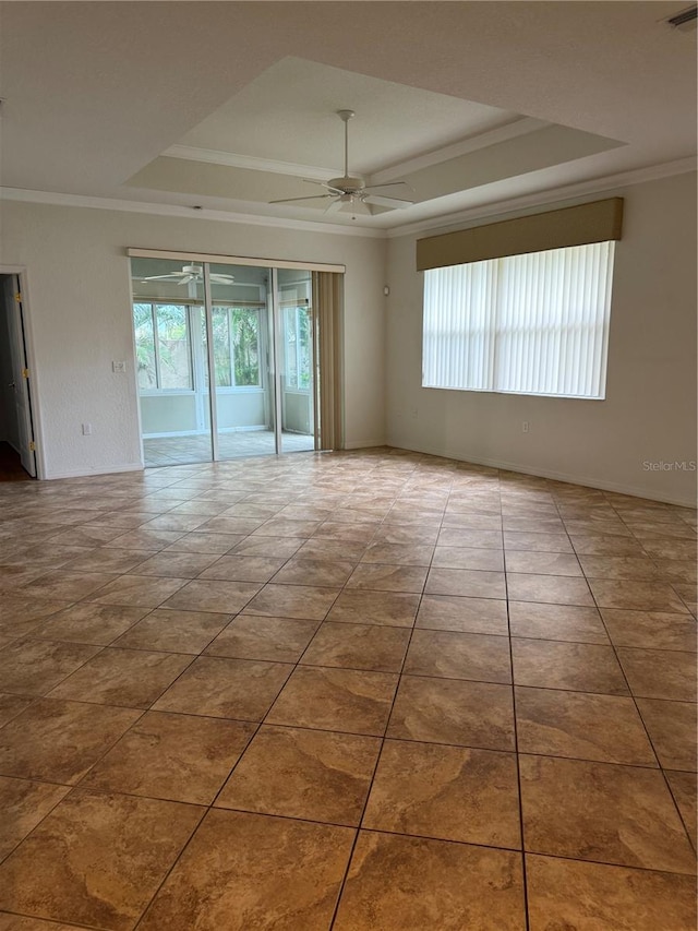 3790 Cadbury Cir Unit 40, Venice, FL 34293 - unfurnished room featuring ceiling fan, crown molding, and a tray ceiling
