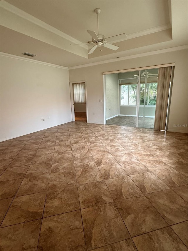 3790 Cadbury Cir Unit 40, Venice, FL 34293 - empty room with a tray ceiling, crown molding, and ceiling fan