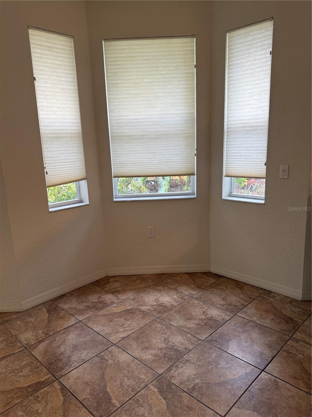3790 Cadbury Cir Unit 40, Venice, FL 34293 - spare room with baseboards