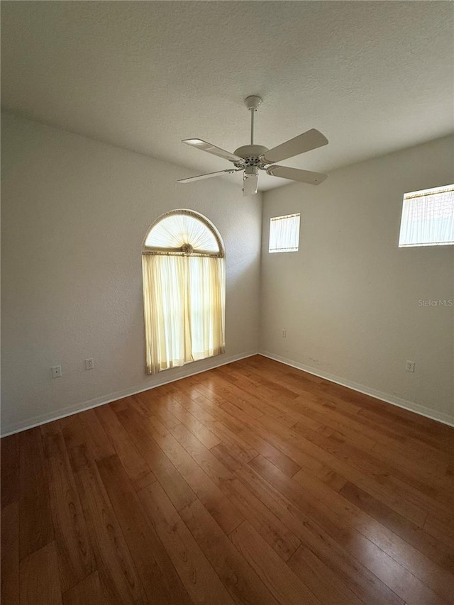 3790 Cadbury Cir Unit 40, Venice, FL 34293 - spare room featuring a ceiling fan, hardwood / wood-style floors, and baseboards