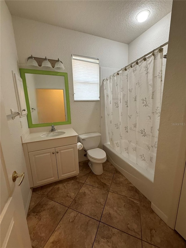 3790 Cadbury Cir Unit 40, Venice, FL 34293 - full bathroom with a textured wall, vanity, toilet, a textured ceiling, and shower / bath combo with shower curtain