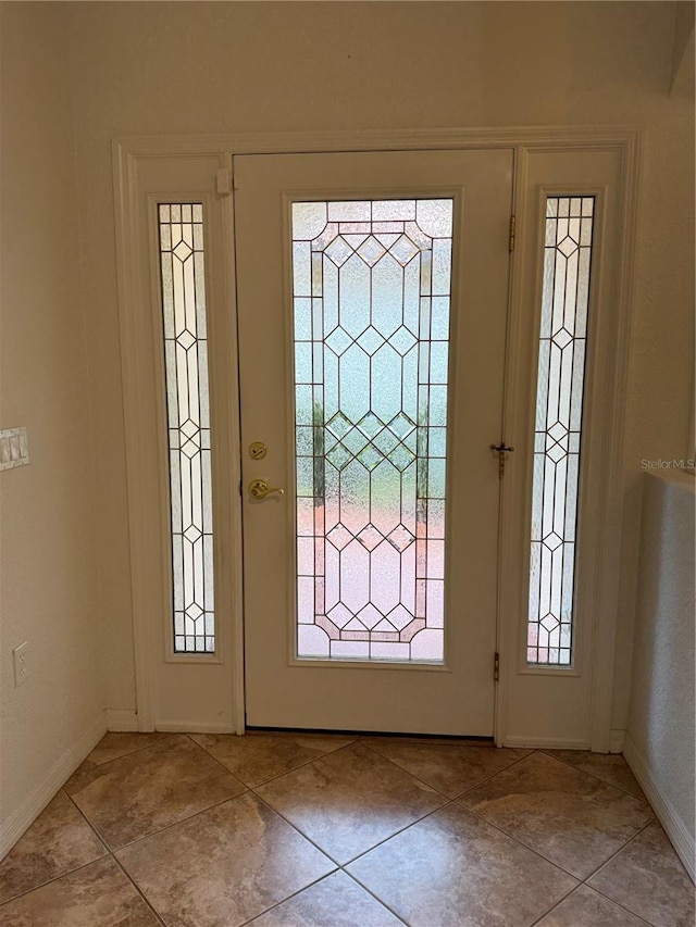 3790 Cadbury Cir Unit 40, Venice, FL 34293 - foyer entrance featuring baseboards and light tile patterned floors