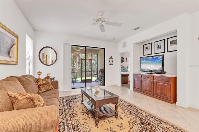 11103 Batello Dr, Venice, FL 34292 - living room with ceiling fan and light tile patterned floors