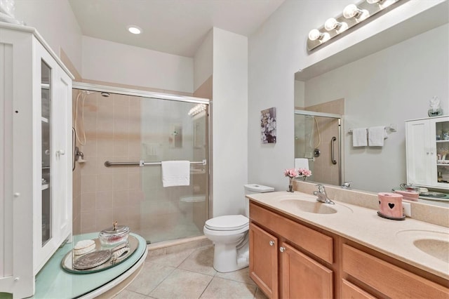 11103 Batello Dr, Venice, FL 34292 - bathroom with a stall shower, tile patterned flooring, and double vanity