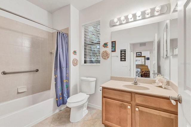 11103 Batello Dr, Venice, FL 34292 - ensuite bathroom featuring vanity, tile patterned floors, and shower / bath combo with shower curtain