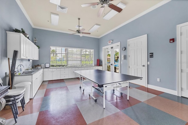 11103 Batello Dr, Venice, FL 34292 - rec room featuring ceiling fan, dark flooring, ornamental molding, french doors, and vaulted ceiling