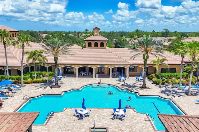 11103 Batello Dr, Venice, FL 34292 - community pool featuring a patio area