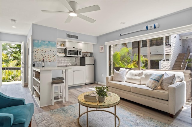 1555 Tarpon Center Dr Unit G 235, Venice, FL 34285 - living area featuring ceiling fan and light wood-style flooring