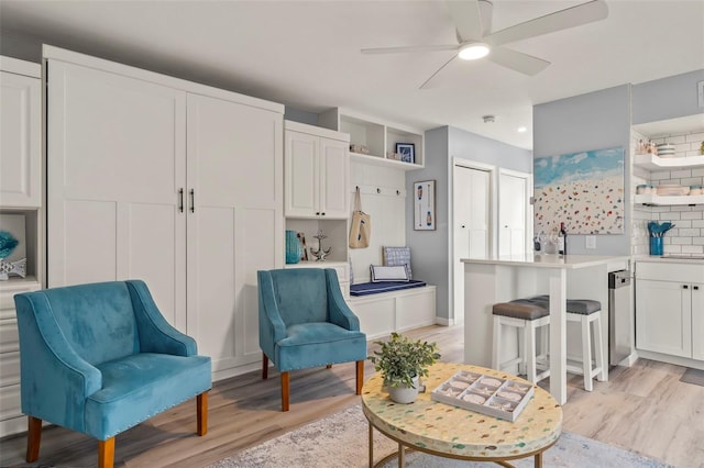 1555 Tarpon Center Dr Unit G 235, Venice, FL 34285 - sitting room featuring light wood-style floors and ceiling fan