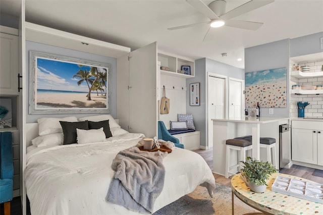 1555 Tarpon Center Dr Unit G 235, Venice, FL 34285 - bedroom with light wood finished floors, ceiling fan, and recessed lighting