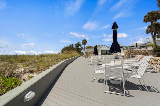 1555 Tarpon Center Dr Unit G 235, Venice, FL 34285 - wooden deck with outdoor dining area