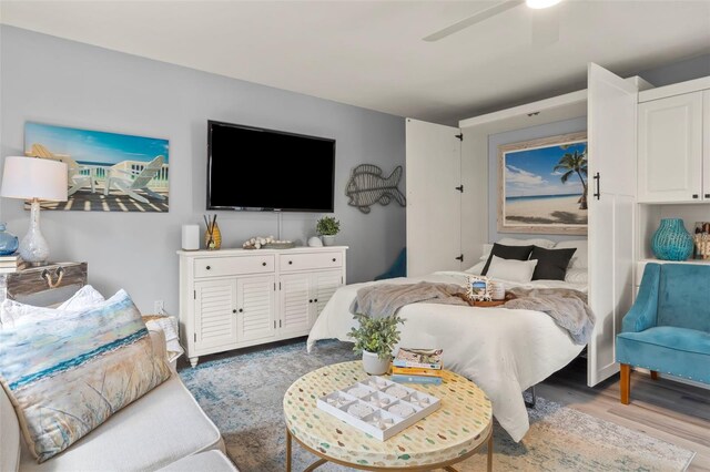 1555 Tarpon Center Dr Unit G 235, Venice, FL 34285 - bedroom featuring wood finished floors and ceiling fan