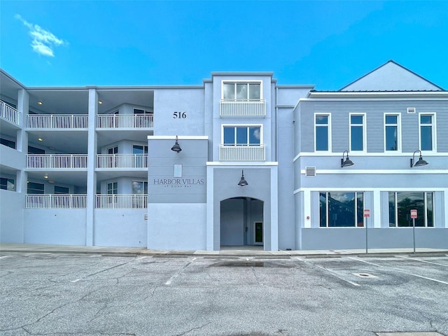 516 Tamiami Trl S Unit 303, Nokomis, FL 34275 - view of building exterior with uncovered parking