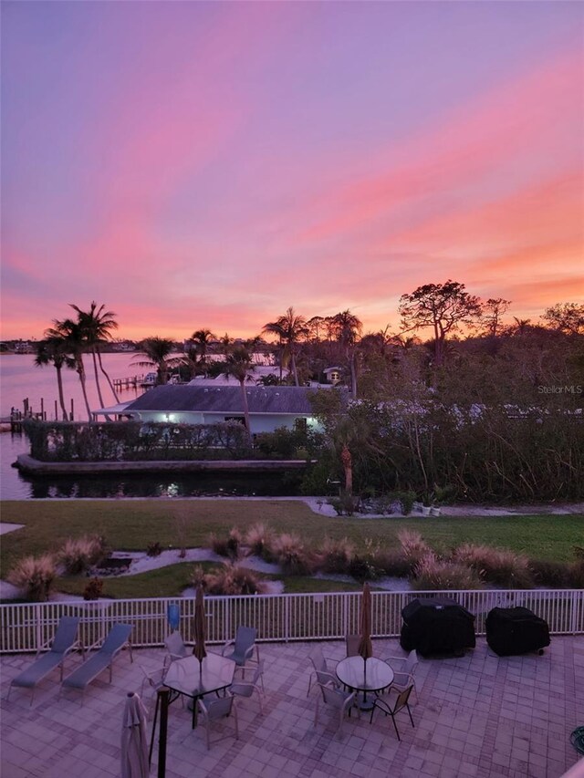 516 Tamiami Trl S Unit 303, Nokomis, FL 34275 - view of patio / terrace featuring a water view and a grill