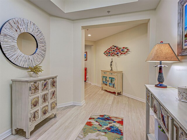 516 Tamiami Trl S Unit 303, Nokomis, FL 34275 - hallway featuring light wood-style flooring and baseboards