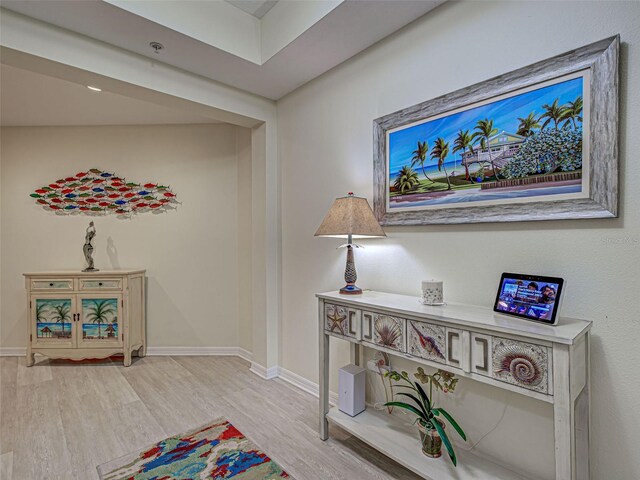 516 Tamiami Trl S Unit 303, Nokomis, FL 34275 - hallway with light wood-style flooring and baseboards