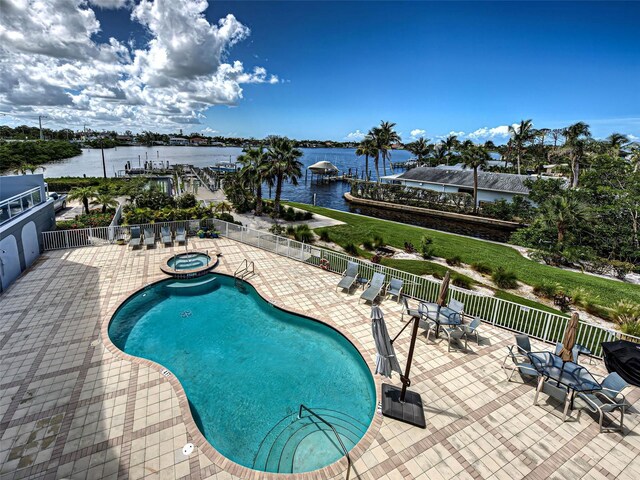 516 Tamiami Trl S Unit 303, Nokomis, FL 34275 - community pool with a patio area, a community hot tub, and a water view