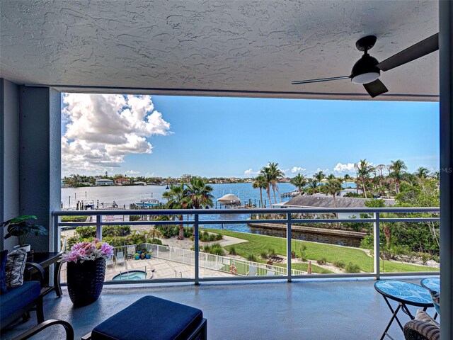 516 Tamiami Trl S Unit 303, Nokomis, FL 34275 - balcony featuring a water view, a hot tub, and ceiling fan