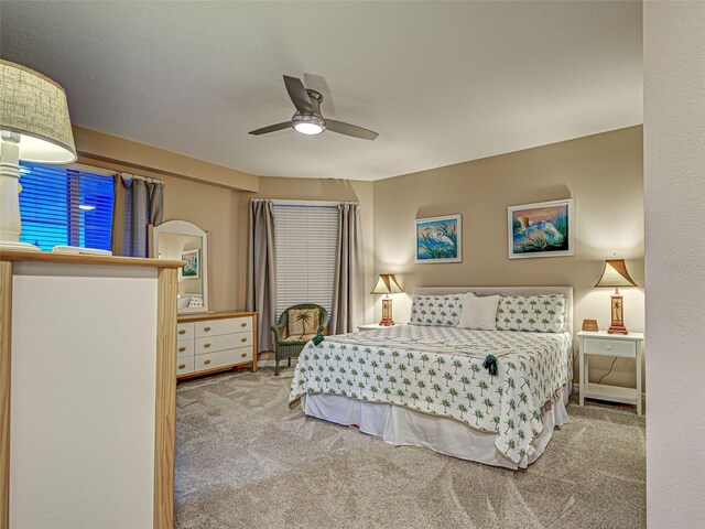 516 Tamiami Trl S Unit 303, Nokomis, FL 34275 - carpeted bedroom featuring a ceiling fan