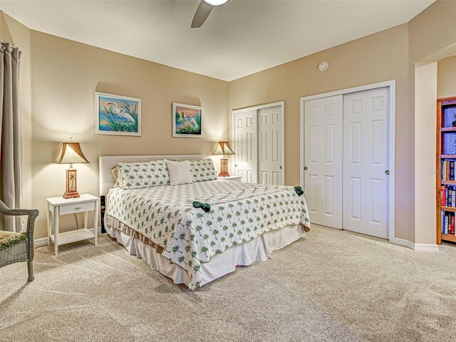 516 Tamiami Trl S Unit 303, Nokomis, FL 34275 - bedroom with carpet floors, two closets, and a ceiling fan
